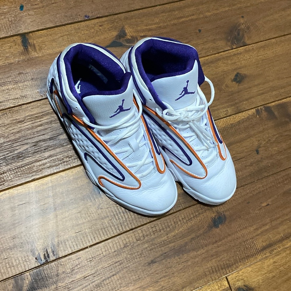 Females Nike Jordan’s white orange and purple (Sz.9.5) N/B but are like new!